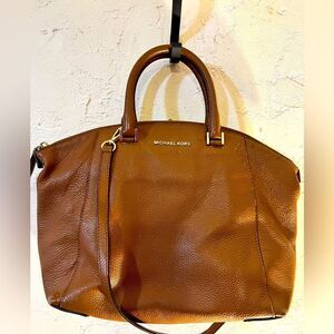 Michael Kors all leather purse with crossbody strap- brown.